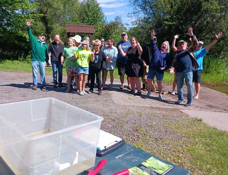 A large group of volunteers posing for a group picture